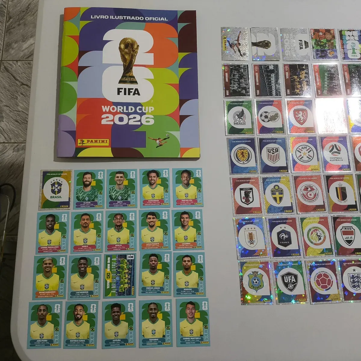 Álbum oficial da Copa 2026 com figurinhas imprimíveis em PDF · capa Panini + coleção Brasil + Legends